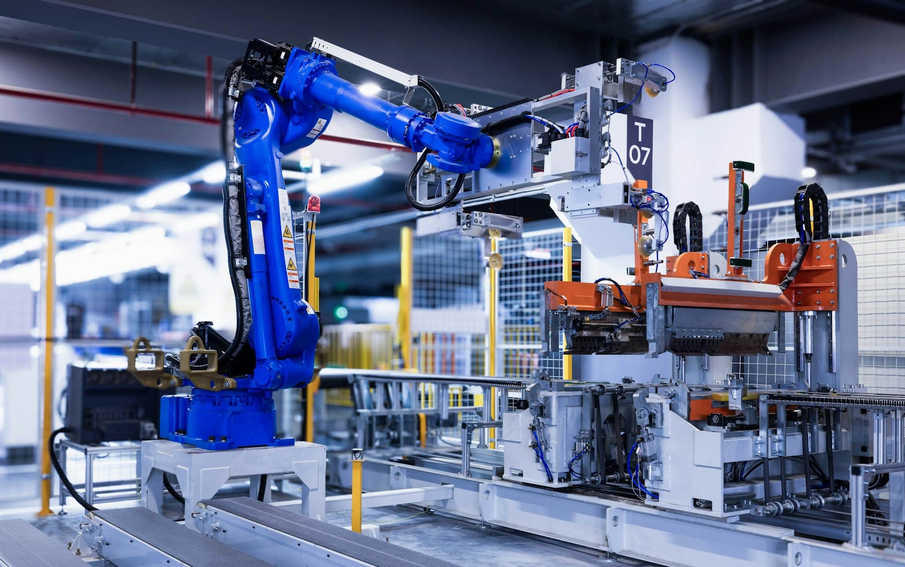 An industrial robot arm on a factory line